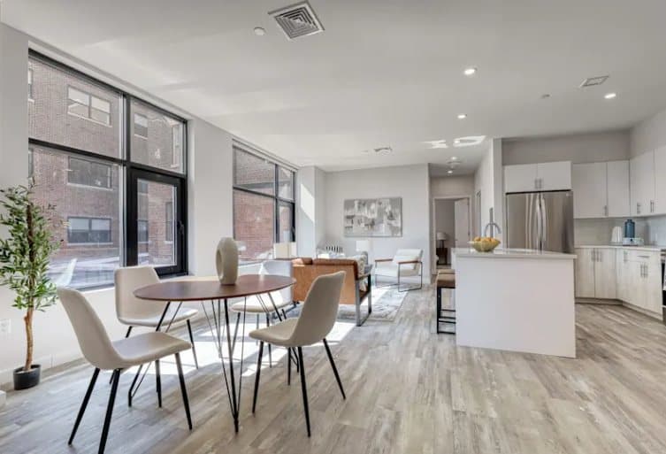 A residence at The Pennington: dining table, living room and kitchen