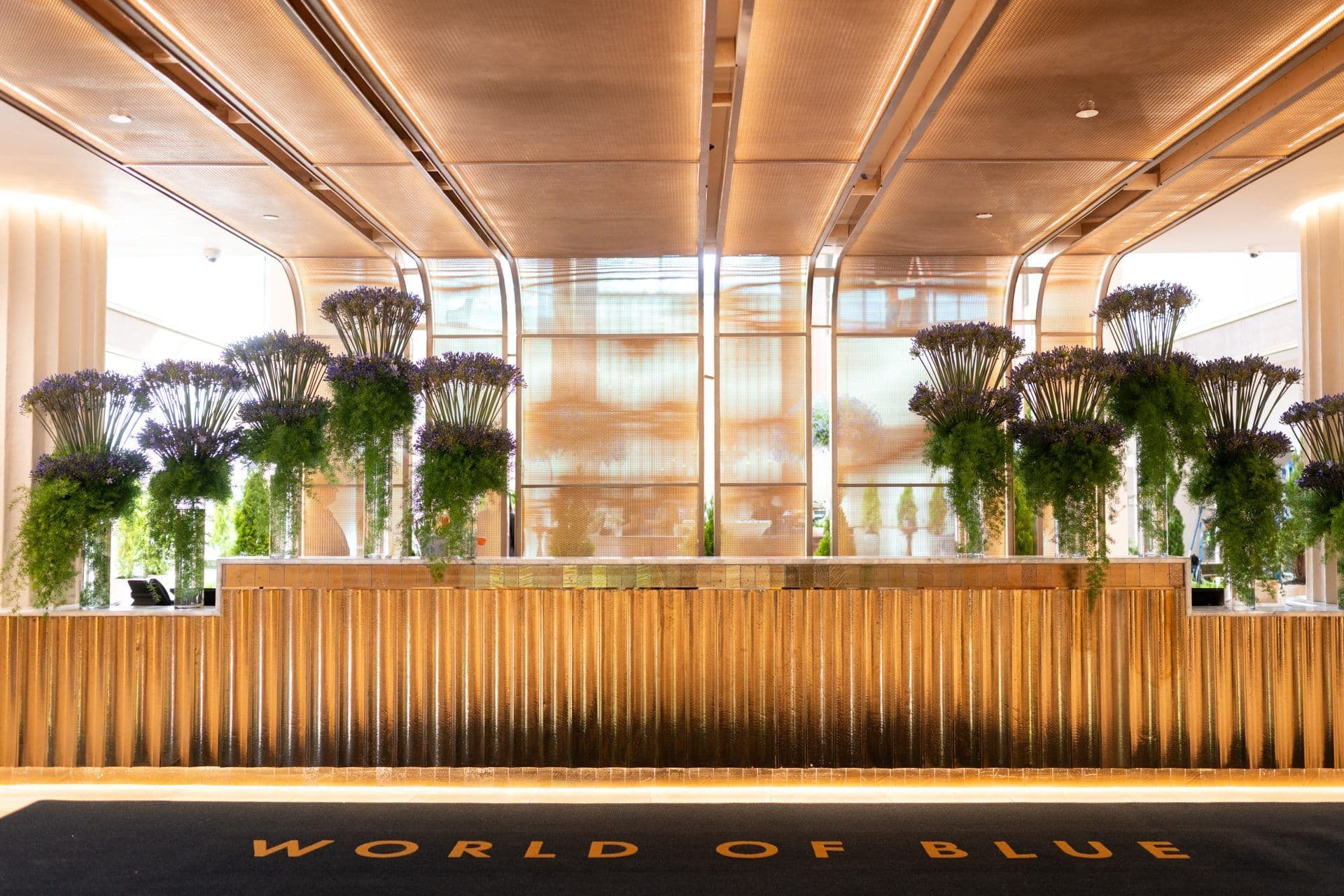 The World of Blue front desk, with the name woven into the carpet