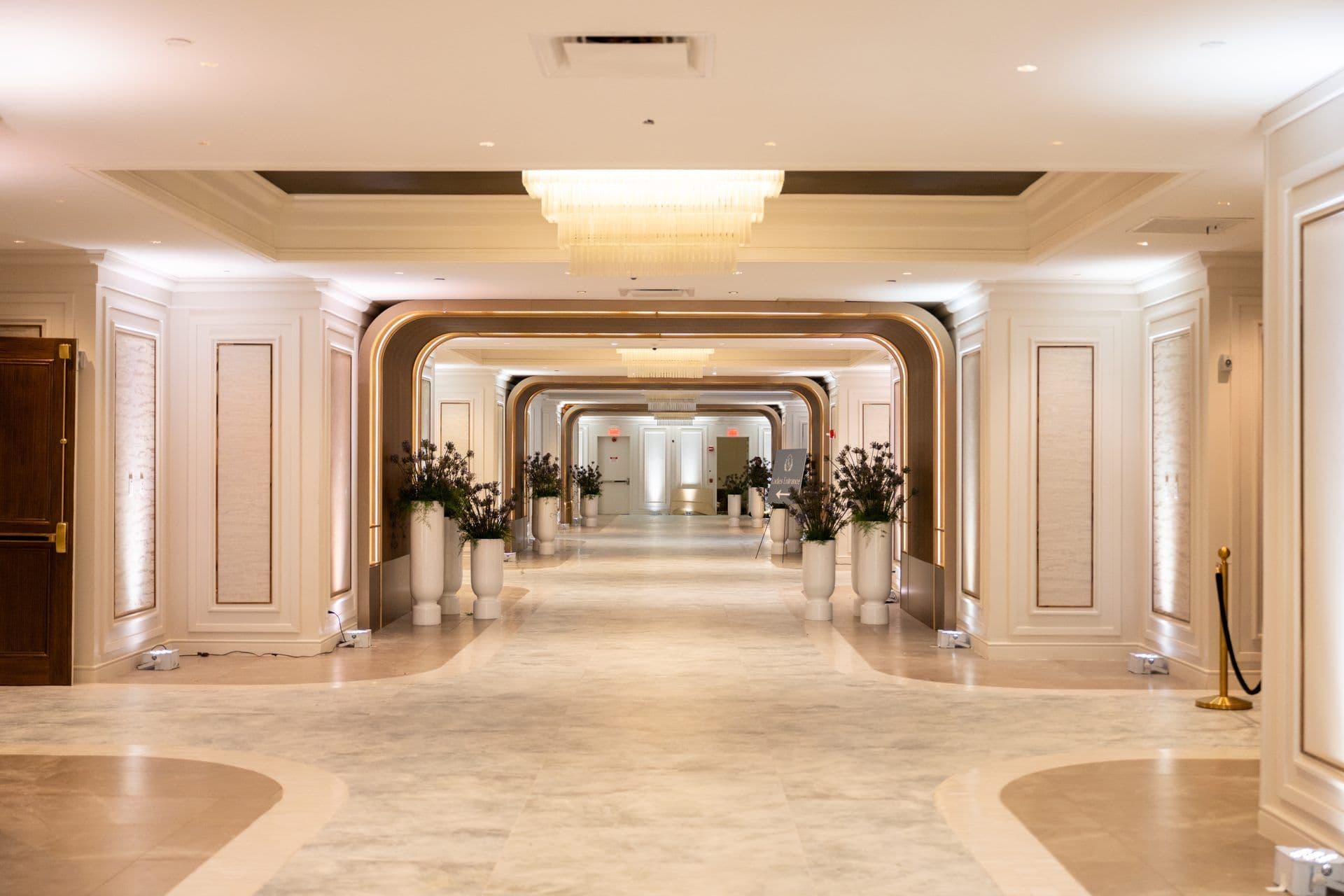 The arched event-floor hallway
