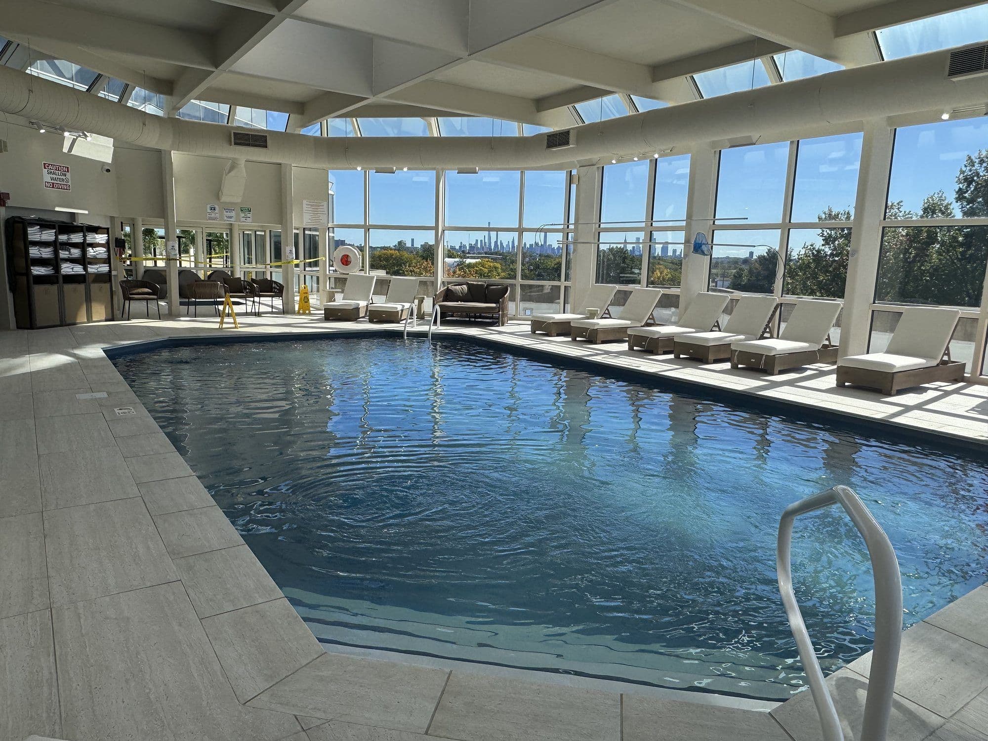 The glass-walled pool on the third floor