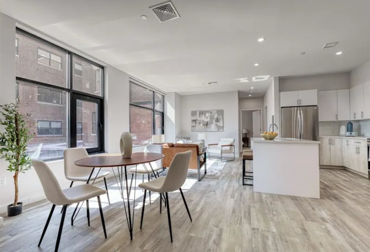 A residence at The Pennington: dining table, living room and kitchen